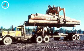 Load is then removed from the truck for storage in the log yard. Load is then removed from the truck for storage in the log yard.
